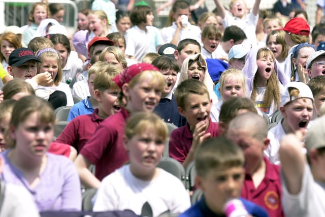 School children enjoy the music at a Breeze 2001 event at Millennium Square in June 2001.