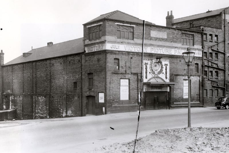 The Victory Cinema on Camp Road in April 1958. The cinema has carved stone band with the name 'Victory Picture Palace' and the date July 1920. Cinema historians give the exact opening date as August 16, 1920. It was closed on January 19, 1959. The adjacent building to the right was the Victory Halls, at this time it was Sassoons tailoring factoring. Crawford Street is to the left.