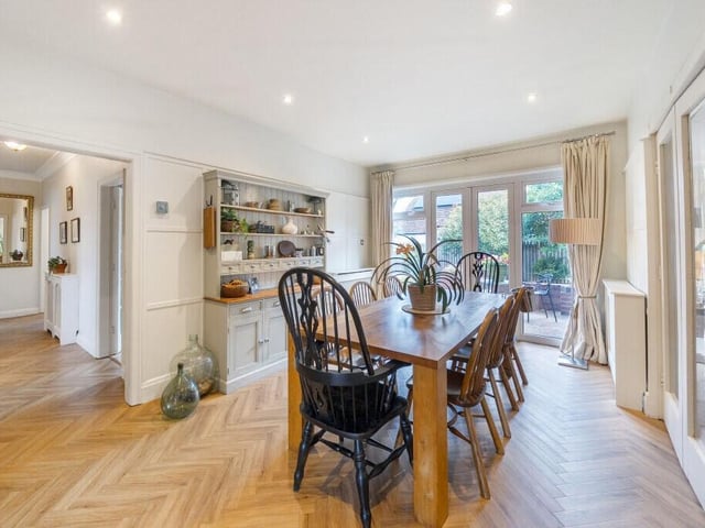 This area flows effortlessly into a dining space and informal living zone, providing a light-filled and sociable environment for family gatherings and meals.