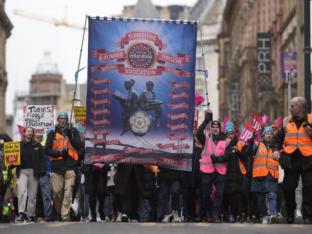 Teaching staff and NEU members march through Leeds as part of a continuing dispute over pay and conditions.