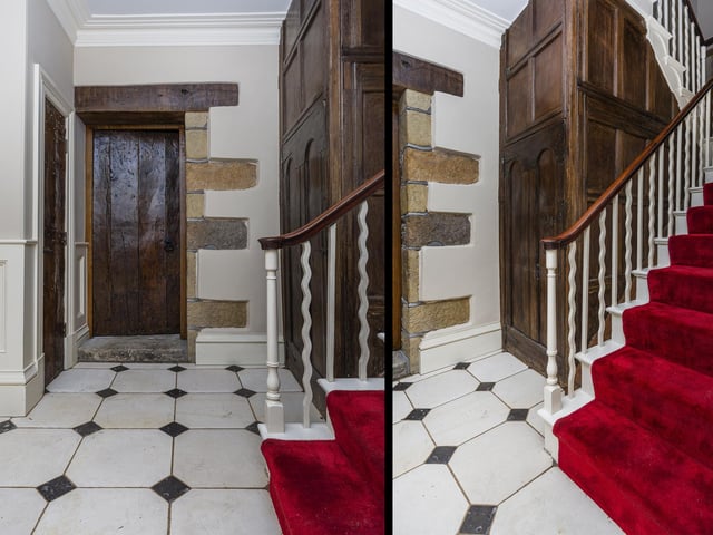 A feature staircase takes you up to the first and second floors from the panelled hallway.