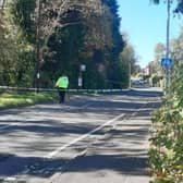 Police remain at the scene on Rooks Nest Road after the girl was found lying in the road close to a bus stop.