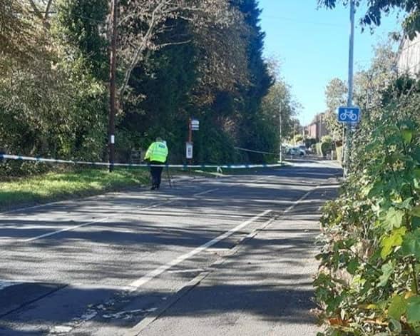 Police remain at the scene on Rooks Nest Road after the girl was found lying in the road close to a bus stop.