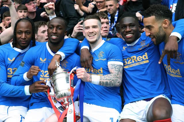 WINNER: Glen Kamara, second left, with former Rangers teammates Joe Aribo, Ryan Kent, Calvin Bassey and Connor Goldson with the 2022 Scottish Cup. Photo by Ian MacNicol/Getty Images.