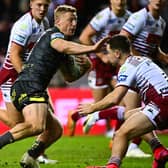 Lachie Miller evades Jai Field during Leeds Rhinos' defeat at Wigan Warriors last week. Picture by Olly Hassell/SWpix.com.