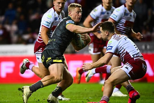 Lachie Miller evades Jai Field during Leeds Rhinos' defeat at Wigan Warriors last week. Picture by Olly Hassell/SWpix.com.