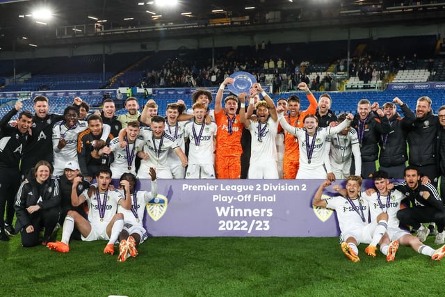 Leeds United skippers Harry Christy and Mateo Joseph lift the PL2 play-off final trophy at Elland Road (Pic: Leeds United)