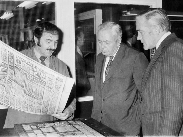 Sir Harold Wilson is shown a page being made ready for the presses by Tony Laycock from the stereo department during a visit to the Yorkshire Evening Post on Wellington Street in January 1977.