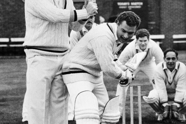 Arnie Sidebottom keeps colleague Kevin Sharp dry when Yorkshire CCC played Pudsey St. Lawrence to launch Arnie's benefit year. Kevin Sharp made 71 as Yorkshire reached 171 for 2 and in reply Pudsey made 170 for 3 in the match which attracted more than 500 spectators.