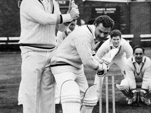 Arnie Sidebottom keeps colleague Kevin Sharp dry when Yorkshire CCC played Pudsey St. Lawrence to launch Arnie's benefit year. Kevin Sharp made 71 as Yorkshire reached 171 for 2 and in reply Pudsey made 170 for 3 in the match which attracted more than 500 spectators.