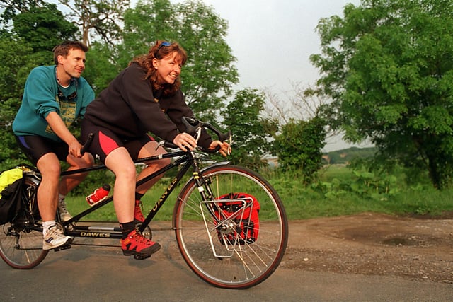 In tandem. This is Clare Metcalf and Paul Hucknall from near Otley who were planning on spending their honeymoon riding a tandem. They are pictured in June 1997.