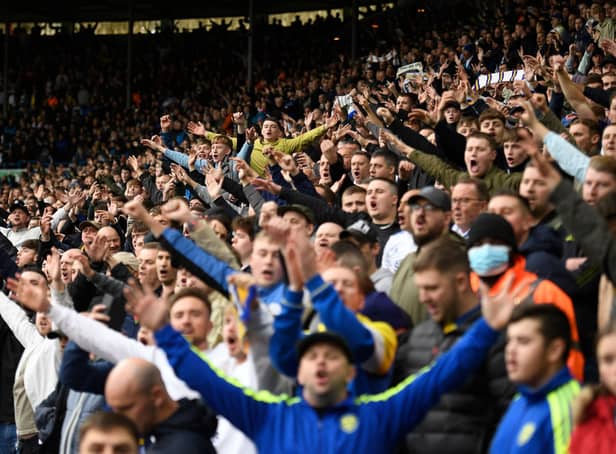 Leeds fans cheer before kick off of the English Premier League football match between Leeds United and Wolverhampton Wanderers at Elland Road. (Photo by OLI SCARFF/AFP via Getty Images)