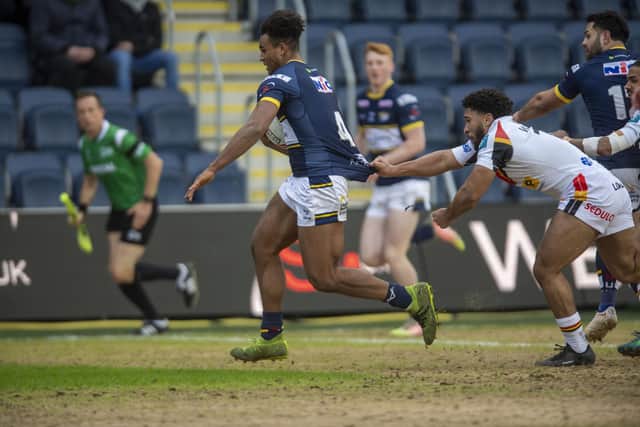 Leon Ruan on his way to scoring for Rhinos against Bradford.  Picture by Tony Johnson.