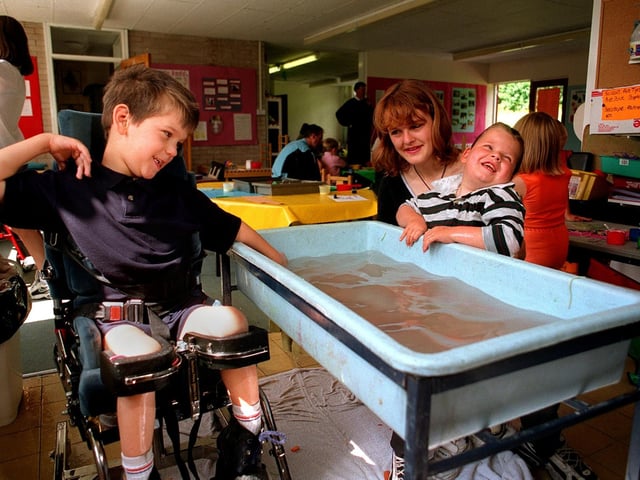 Children enjoy themselves on the 'family fun scheme' at John Jamieson School in Oakwood in July 1997. Pictured, from left, are Nathan Pride and Sharon Bottomley with her son Jordan.