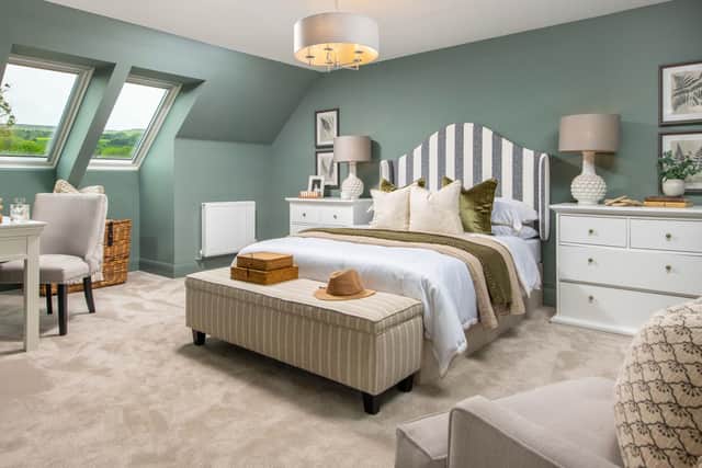 BG - A bedroom inside a David Wilson Homes show home designed by David Wilson Homes