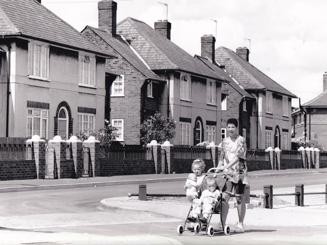 A mum and her two young children make their way down Coldcotes Crescent in July 1992.