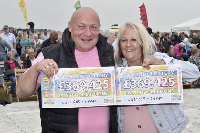 Paul and Julie Meehan show off their People's Postcode Lottery winnings. (Pic: Steve Riding)