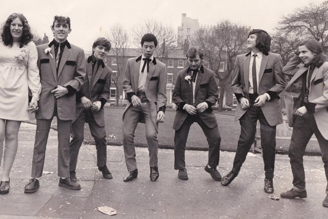 A bridge and bridegroom (far left) and five of the bridegroom's Teddy Boy friends jive in Park Square in February 1973 after a wedding at Leeds Registry Office. The bridegroom was Michael Shaw and the bride was Sharman Dearlove. The five friends are, from left, Danny Gardner, Michael Allotey, Peter Shaw, Neil Higginbottom and Graham Turner.