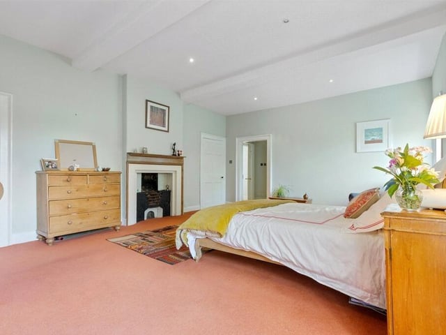 The master bedroom also includes a feature fireplace, walk in wardrobe and en suite bathroom