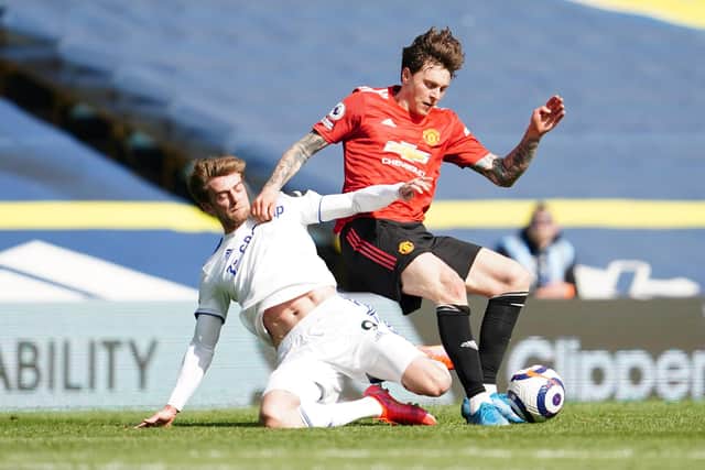 Victor Lindelof of Manchester United is tackled by Patrick Bamford of Leeds United during the Premier League match between Leeds United and Manchester United at Elland Road. (Photo by Jon Super - Pool/Getty Images)