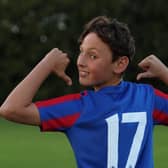 A Moorthorpe U14s player shows off the new kit