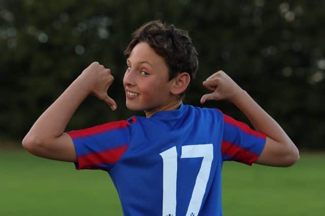 A Moorthorpe U14s player shows off the new kit