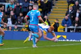 Luis Roberts scores Rhinos' first try in the Boxing Day Festive Challenge against Wakefield.  Picture by Steve Riding.