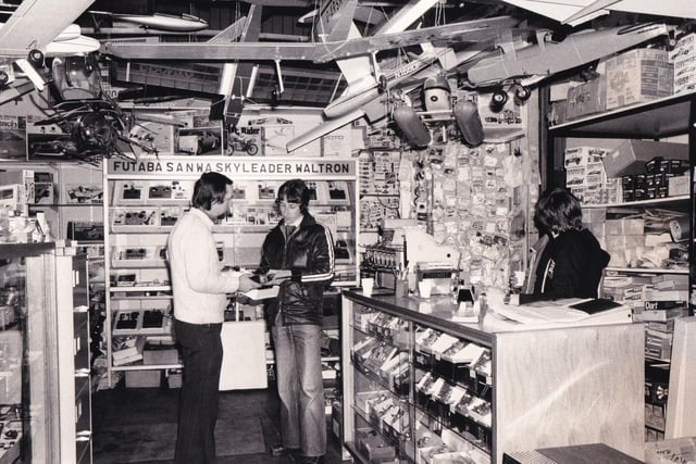 Brian Stockton discusses a radio control device with a customer in the Morley Models shop. Pictured in March 1980.