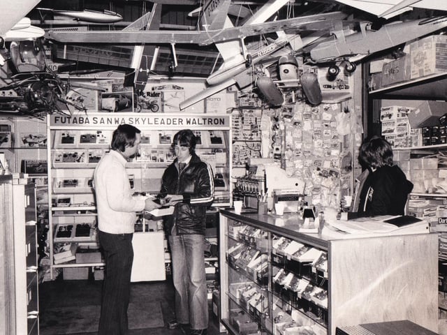 Brian Stockton discusses a radio control device with a customer in the Morley Models shop. Pictured in March 1980.