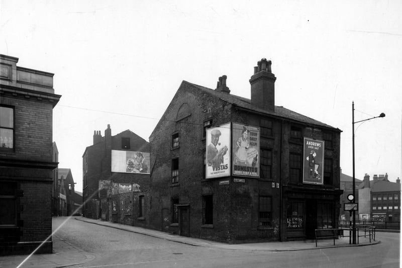 Looking south-west at the north end of Garden Street at the junction with Marsh Lane in March 1949 where Lillywhite's Fisheries can be seen. Advertisements on hoardings for Andrew's Liver Salts, Domestos, Swan Vestas matches and a film poster for 'Night Song'.