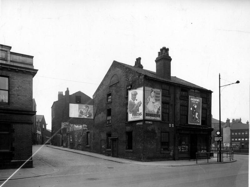 Looking south-west at the north end of Garden Street at the junction with Marsh Lane in March 1949 where Lillywhite's Fisheries can be seen. Advertisements on hoardings for Andrew's Liver Salts, Domestos, Swan Vestas matches and a film poster for 'Night Song'.