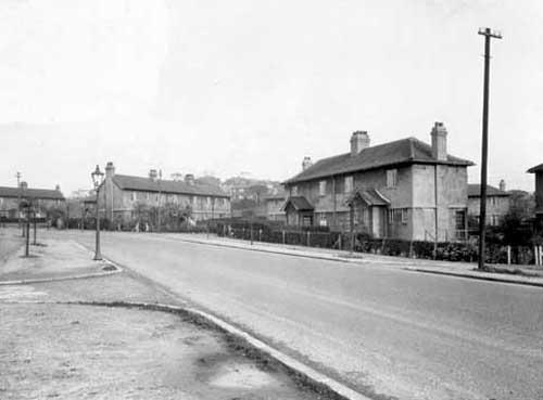 Stainbeck Road, looking from Meanwood Road in October 1933. The first turning on both sides of the road is with Stainbeck Crescent, then on the right we can see houses numbered 2 and 4 Stainbeck Road before the junction with Stainbeck Side. Pictured are some of the earliest council houses built in the 1920s, which have since been demolished and replaced with modern housing. A gas lamp can be seen to the left.