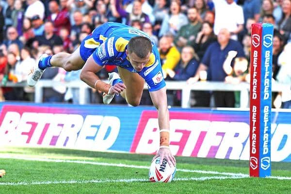 Ash Handley scores a spectacular try for Leeds Rhinos agianst Castleford Tigers at AMT Headingley. Picture by John Clifton/SWpix.com.