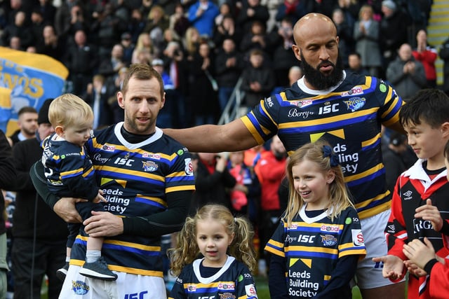 Rob Burrow and Jamie Jones-Buchanan, along with their children, on the pitch with their final whistle.