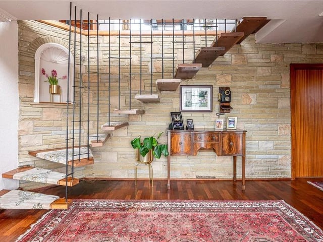 A formal entrance opens onto a full-height entrance hallway, acting as a centrum to the entire ground floor.