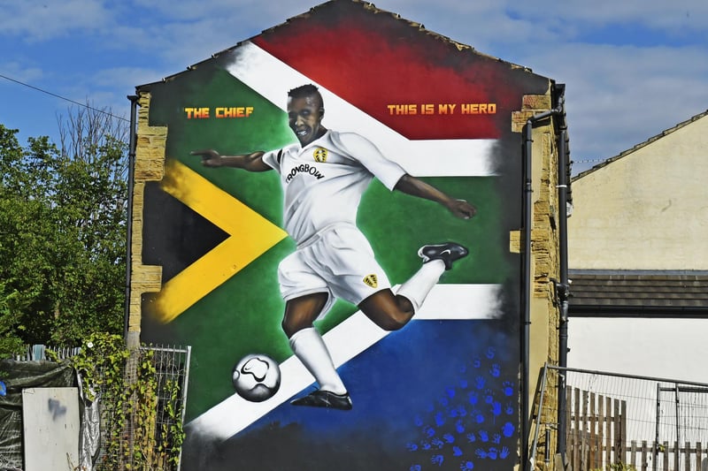 The 35ft mural is dedicated to Leeds United defensive rock and legend Lucas Radebe. The tribute to 'The Chief' is painted onto the side of the Sweeney Todd barbershop on Potternewton Lane, Chapel Allerton, where its owner became a friend to the player during his time at Leeds.