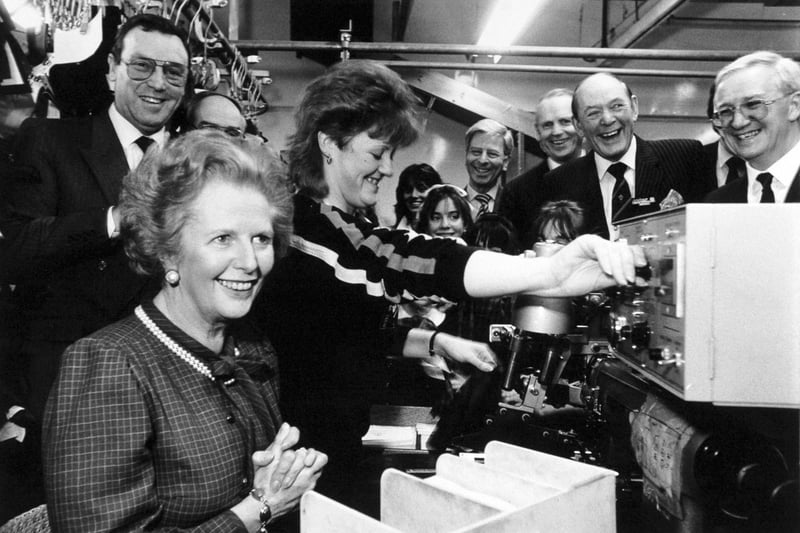 Margaret Thatcher was all smiles as she tried her talents at machining a pocket lining for a jacket during her visit to Centaur Clothes on Great George Street in February 1987. Pictured is Karen Pheasby, who normally works on the machine, showing how it's done. John Jackson, chairman and managing director of Centaur Clothes, is on the left.