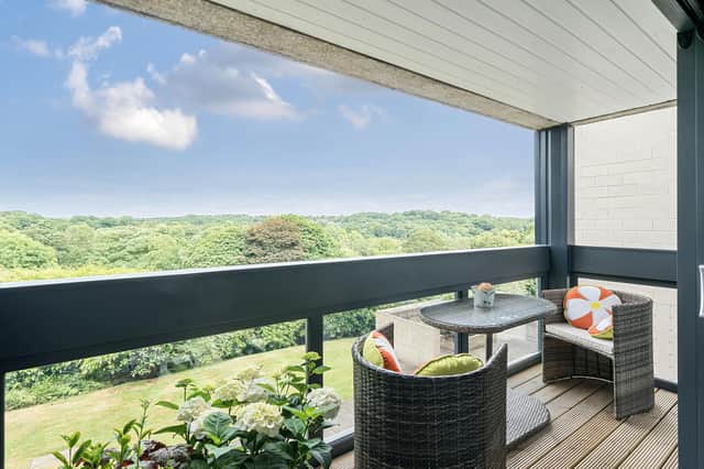 The balcony offers panoramic views across Roundhay Park.
