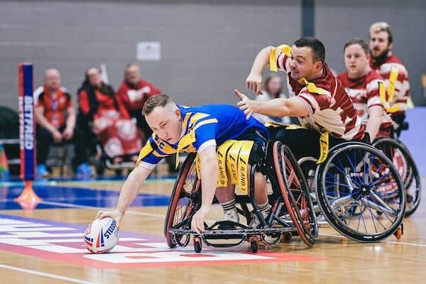 Nathan Collins scores for Leeds Rhinos, but they were pipped by Wigan Warriors in last year's Wheelchair Super League Grand Final in Manchester. Picture by Alex Whitehead/SWpix.com.