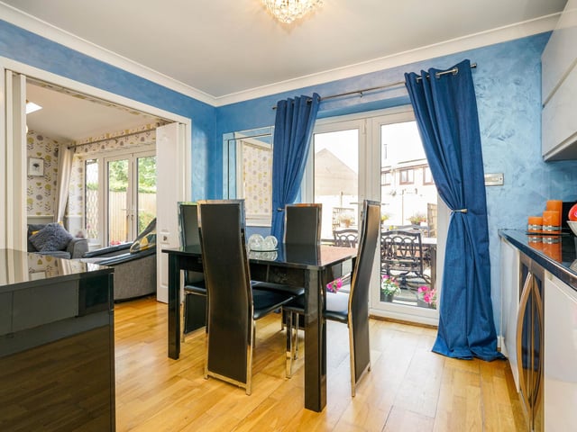 To the rear is the dining area, with views looking out to the fabulous garden.