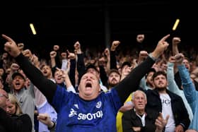 LEEDS, ENGLAND - SEPTEMBER 12: A Leeds United fan sings as the teams walk out during the Premier League match between Leeds United  and  Liverpool at Elland Road on September 12, 2021 in Leeds, England. (Photo by Laurence Griffiths/Getty Images)