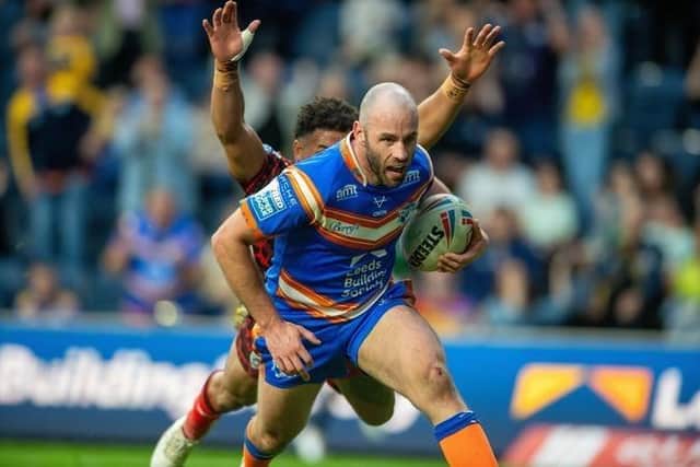 No 7 Matt Frawley scores the decisive try for Leeds Rhinos in their 18-10 win against Leigh Leopards. Picture by Bruce Rollinson.