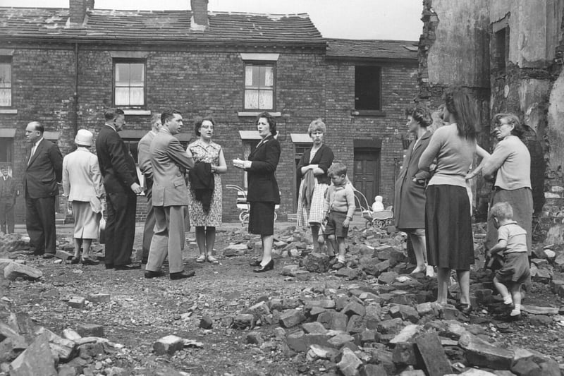 Greystone Street off Kirkstall Road in 1961. Coun May Sexton (centre) talks to members of Leeds City Council and local residents.
