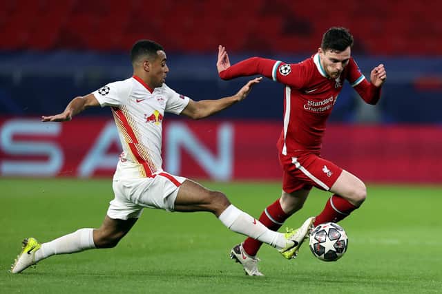 PAST BATTLES: Leeds United's Tyler Adams, left, challenges Liverpool's Andy Robertson for former club RB Leipzig in the UEFA Champions League last 16 clash at the Puskas Arena of February 2021. Photo by David Balogh/Getty Images.