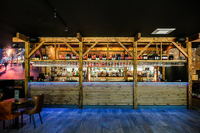 An impressively stocked bar is a show-stopping feature of the new venue.