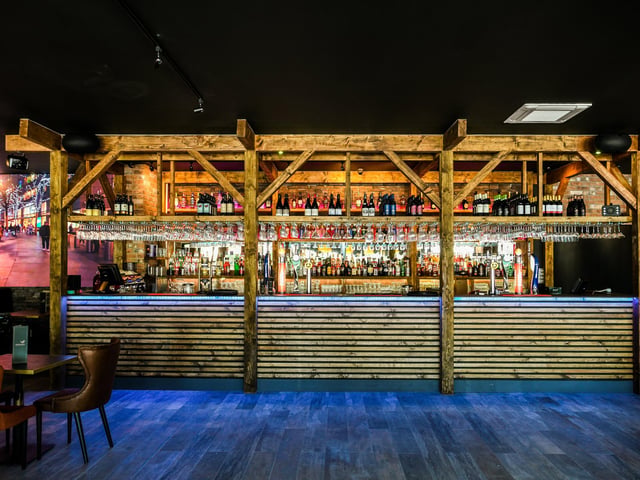 An impressively stocked bar is a show-stopping feature of the new venue.