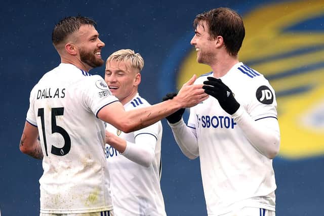 Patrick Bamford of Leeds United celebrates with Stuart Dallas and Ezgjan Alioski. (Photo by Oli Scarff - Pool/Getty Images)