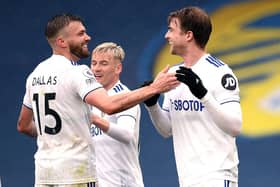 Patrick Bamford of Leeds United celebrates with Stuart Dallas and Ezgjan Alioski. (Photo by Oli Scarff - Pool/Getty Images)