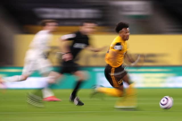 Adama Traore runs with the ball during the Premier League match between Wolverhampton Wanderers and Leeds United at Molineux on February 19, 2021 in Wolverhampton, England. (Photo by Alex Pantling/Getty Images)