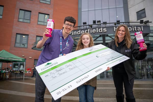 B&DWYW - SGB-69280 - Callum from MY Hospitals Charity receiving a cheque from Gill from Barratt and David Wilson Homes and her niece Beau